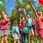 depositphotos_130011136-stock-photo-kids-playing-with-balloons